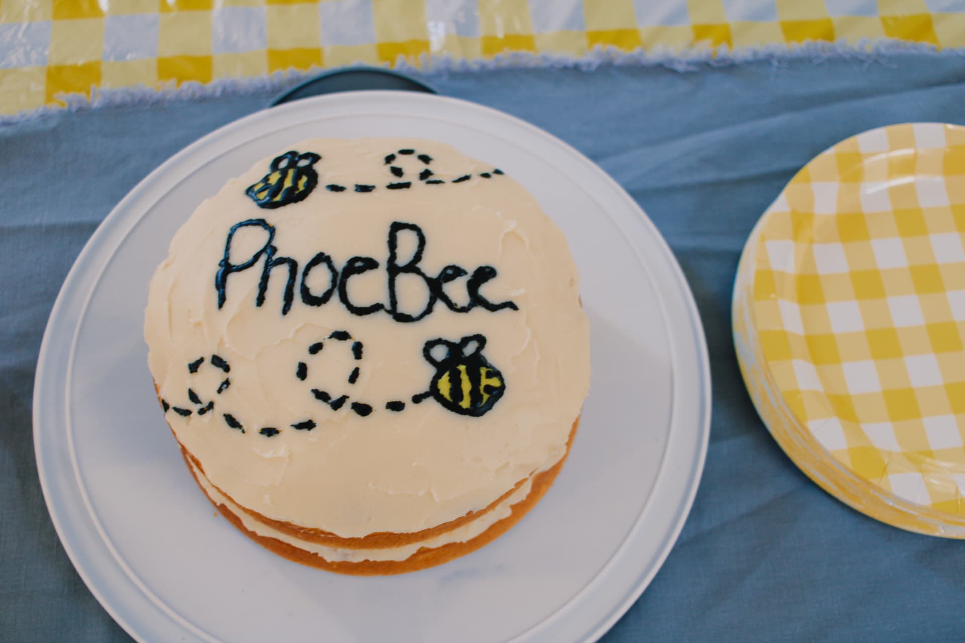 Phoebe's first birthday cake with PhoeBee and bumblebee decorations