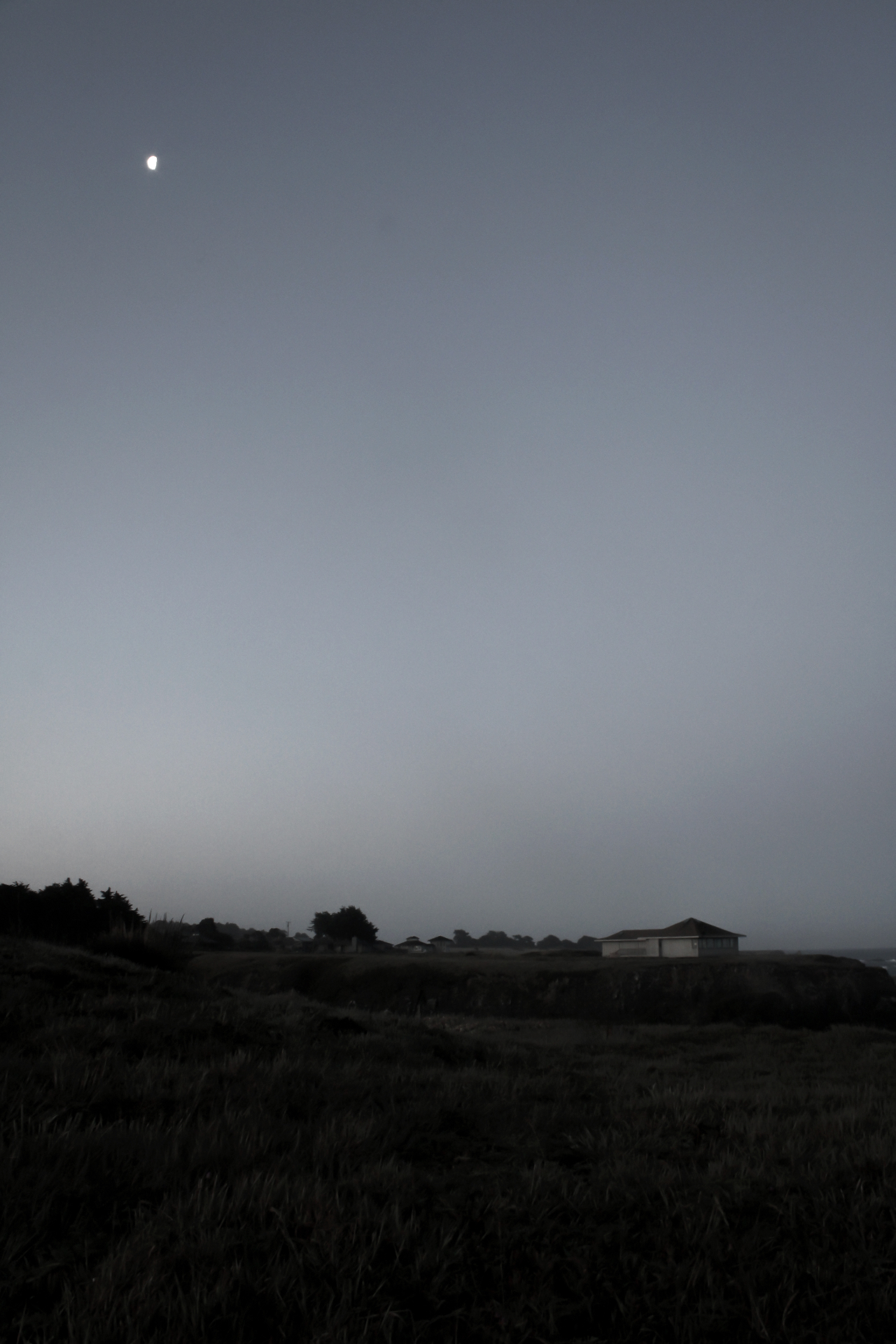 Moon above a quiet Mendocino headland before dawn