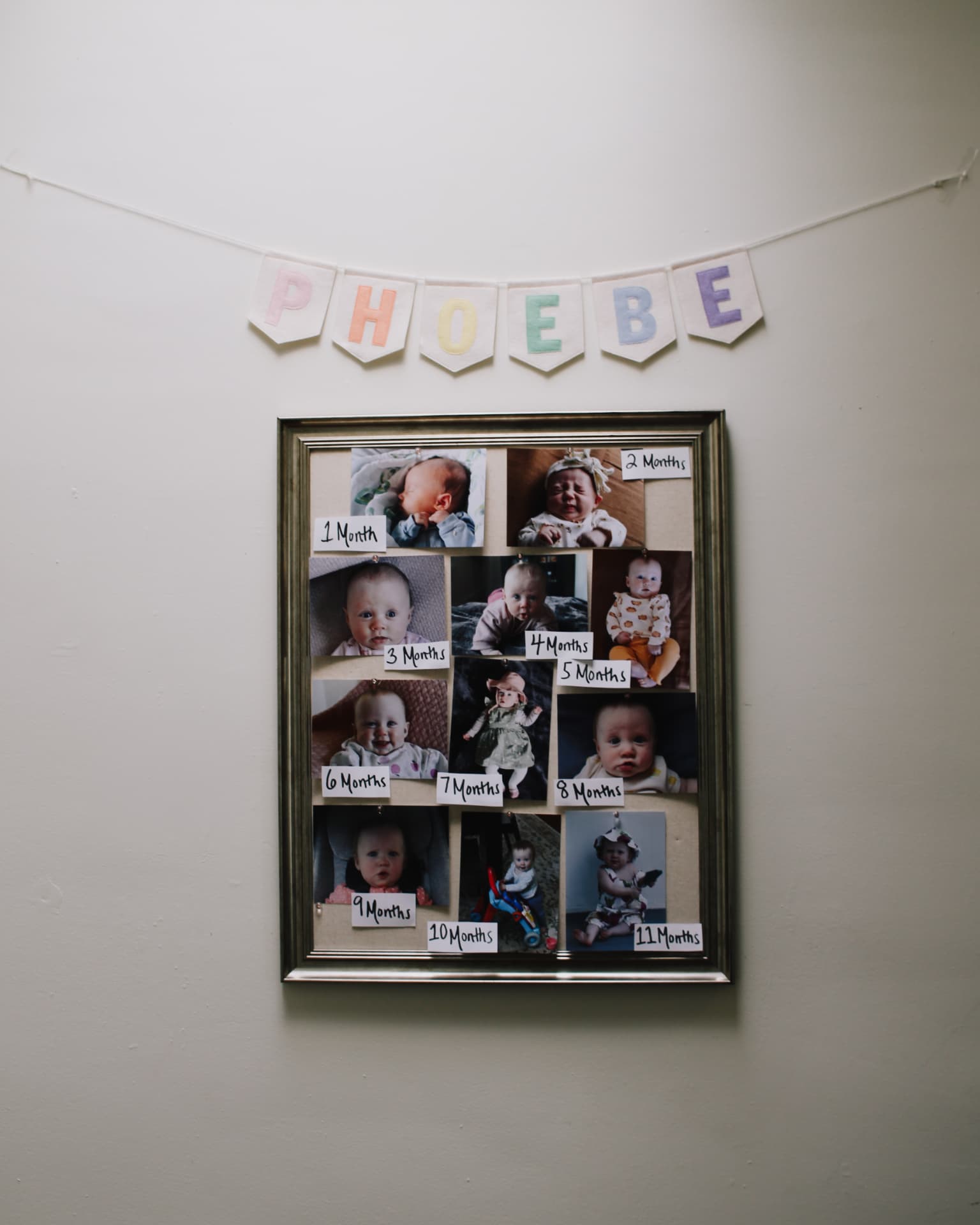 Monthly milestone photo board with Phoebe's first year pictures