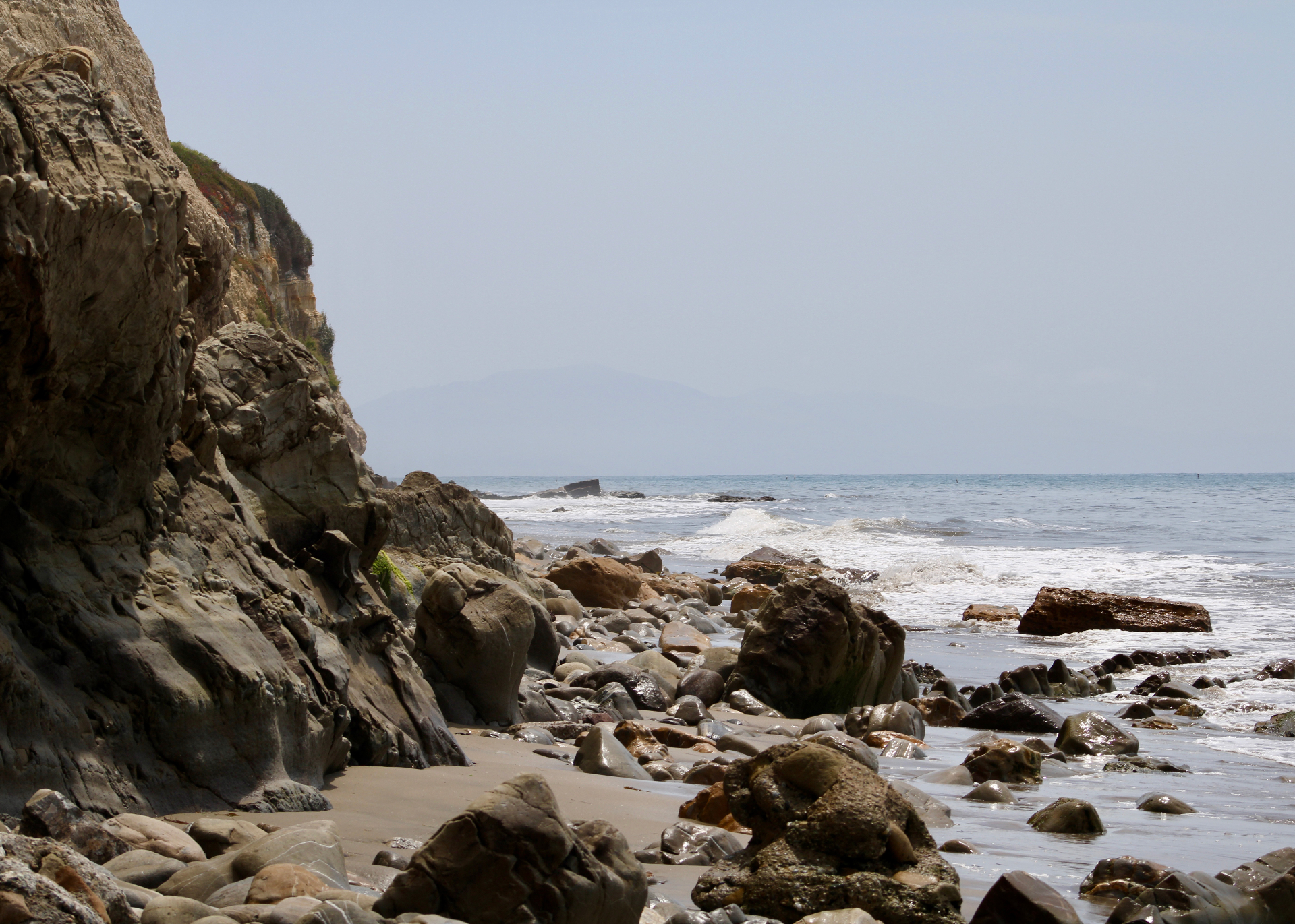 Rocky Santa Barbara coastline with waves washing over the shore